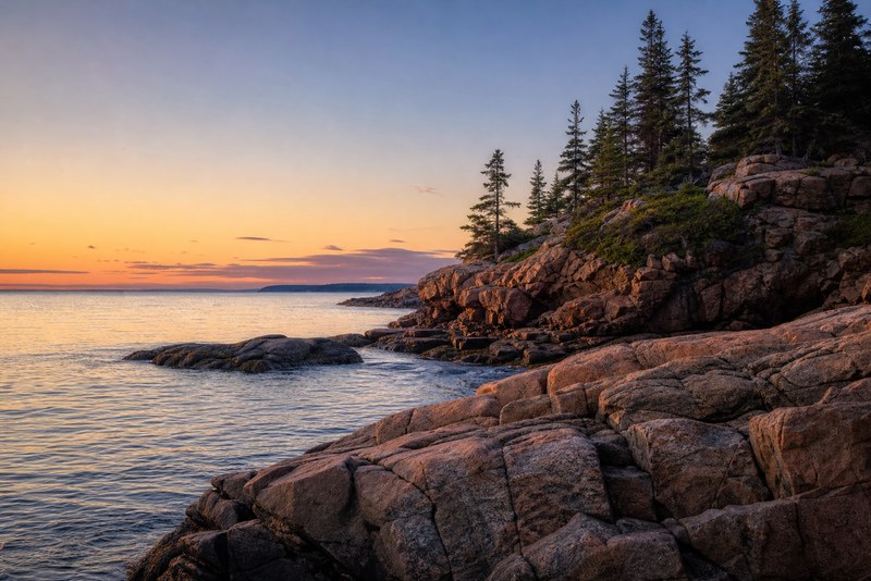 Granite shoreline and sunrise water in Acadia National Park