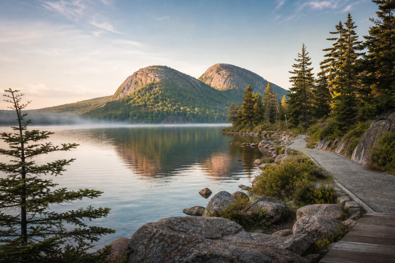 Jordan Pond trail with The Bubbles mountains reflected in water
