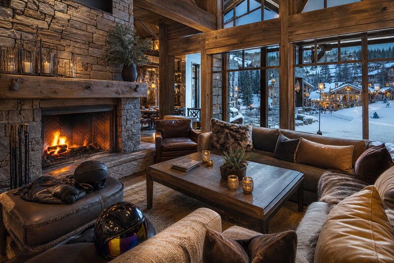 Cozy Beaver Creek lodge lounge with fireplace and ski gear