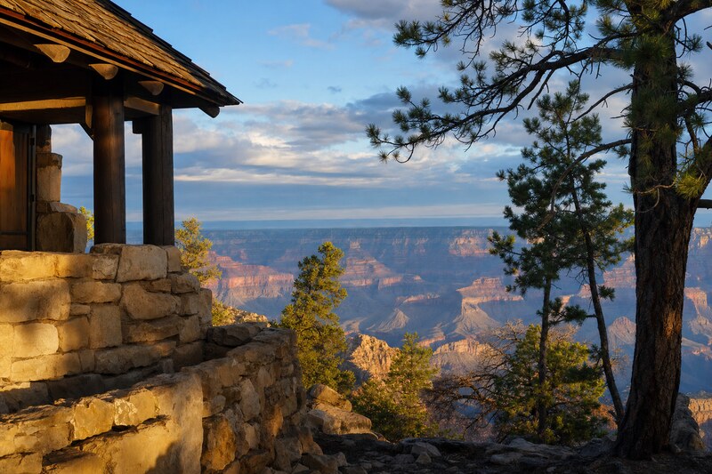 Native-stone and timber architecture beside the Grand Canyon rim