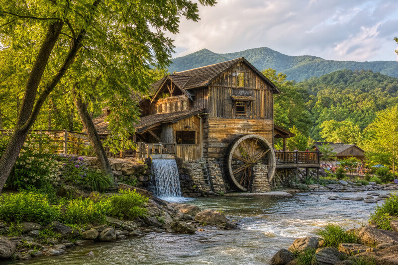 Rustic craft and mill area with Smoky Mountain theme park atmosphere