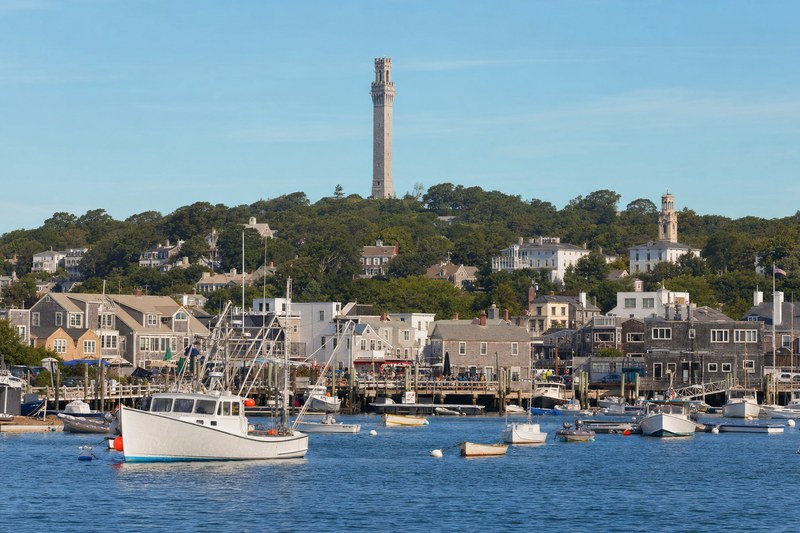 Provincetown harbor with the Pilgrim Monument above town