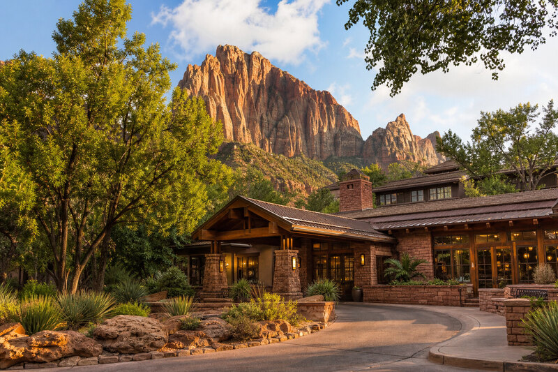 Springdale lodge setting beneath red cliffs