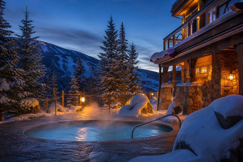 Outdoor hot tub at a snowy Winter Park lodge