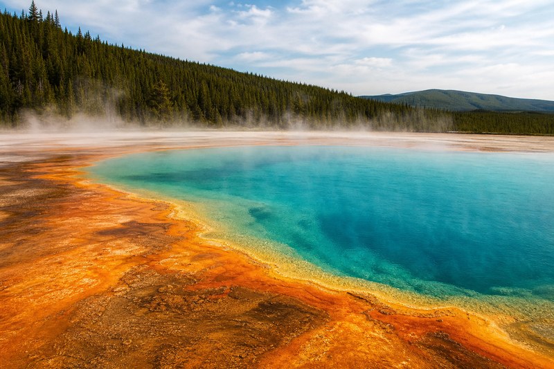 Blue geothermal pool and mineral colors in Yellowstone National Park